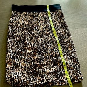 Inc mid length leopard print skirt with wide band.